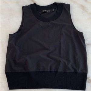 Athleta “Zephyr Shell” sleeveless top.